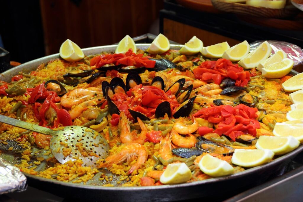 paella, rice, scampi, lemons, spain, national dish, meal, nature, shrimp, food, seafood, shellfish, salmon, fish, fresh, nourishment, mediterranean cuisine